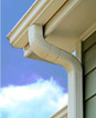 Gutter of a home. Specialty cleaning services include gutter cleaning services, scratched glass repair, and blind cleaning. 