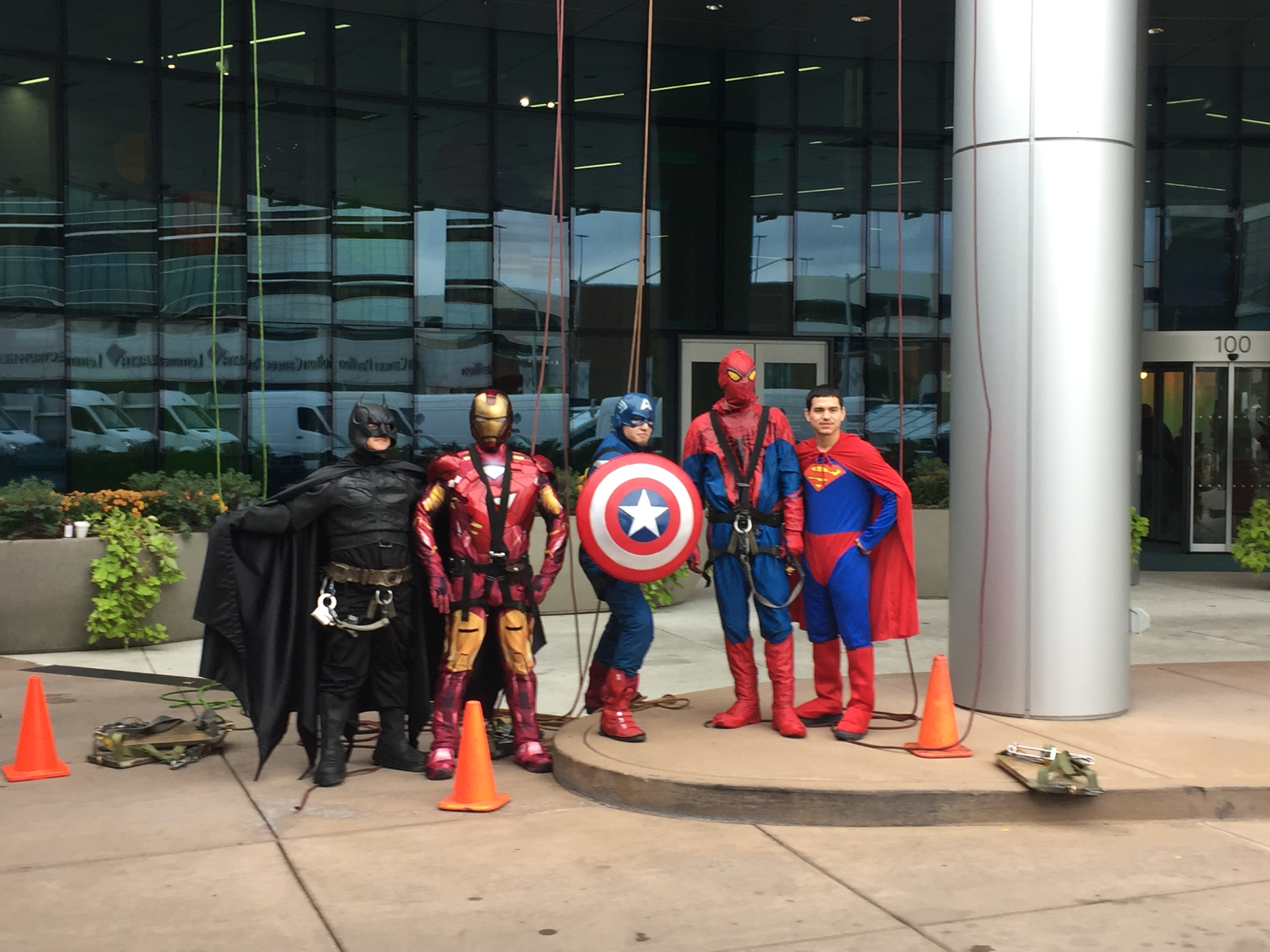 High rise window cleaners dressed up as superheroes to suprise children on Halloween at the hospital